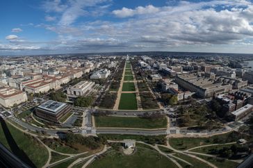 The view of the National Mall in Washington DC looking towards the Capitol featuring prominent buildings and green spaces